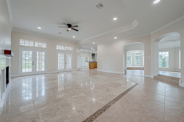 unfurnished living room with french doors, ceiling fan, and ornamental molding