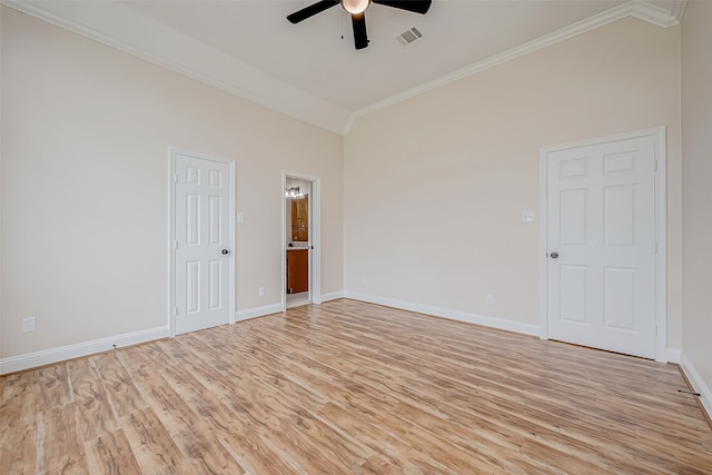 empty room featuring ceiling fan, crown molding, high vaulted ceiling, and light wood-type flooring