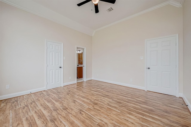 1810 Mccrary Rd, Richmond, TX 77406 - spare room with lofted ceiling, crown molding, a ceiling fan, light wood-style floors, and baseboards