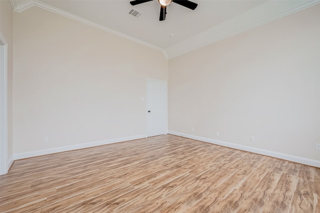 spare room featuring vaulted ceiling, light hardwood / wood-style flooring, ceiling fan, and ornamental molding