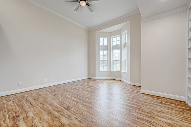 unfurnished room with ceiling fan, light wood-type flooring, and crown molding