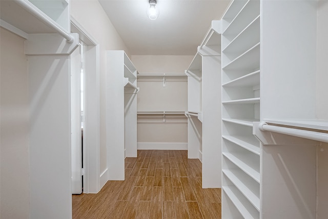 spacious closet with light wood-type flooring