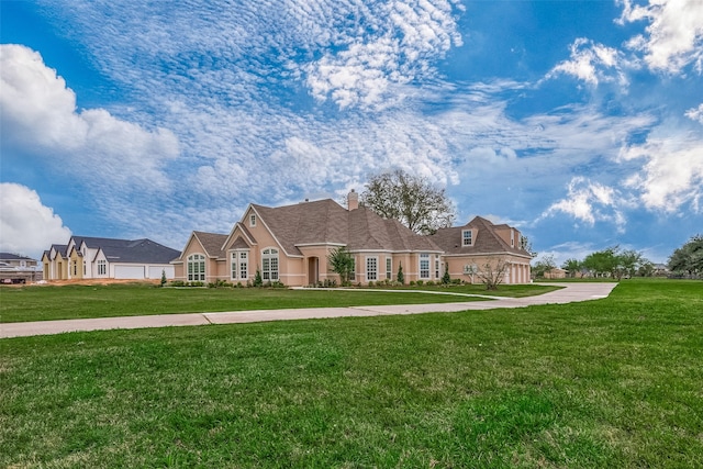 single story home with a front lawn