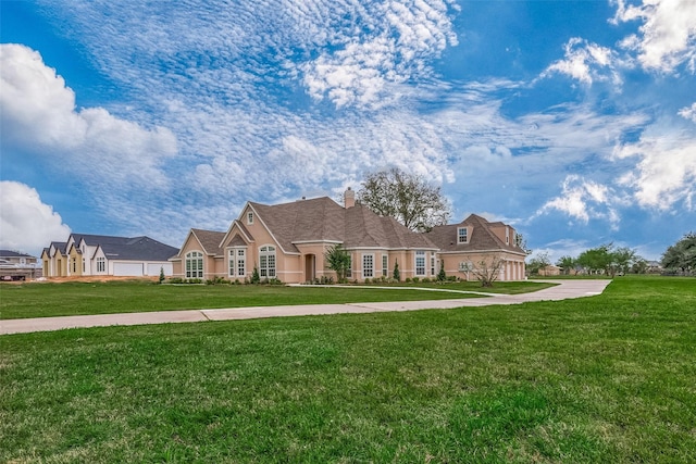 1810 Mccrary Rd, Richmond, TX 77406 - french country inspired facade featuring a front yard, a chimney, and stucco siding