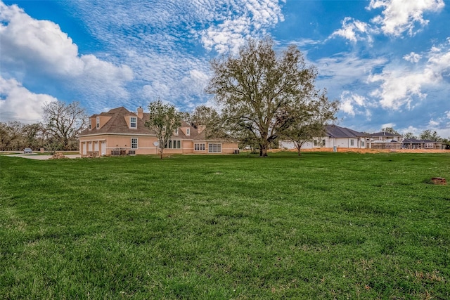 1810 Mccrary Rd, Richmond, TX 77406 - view of grassy yard featuring a garage