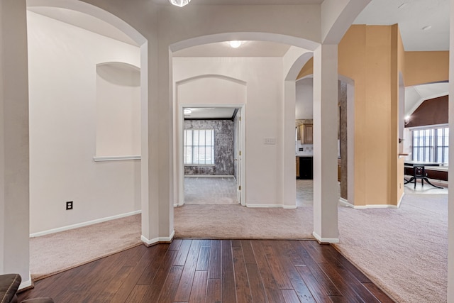 interior space featuring dark hardwood / wood-style floors and plenty of natural light