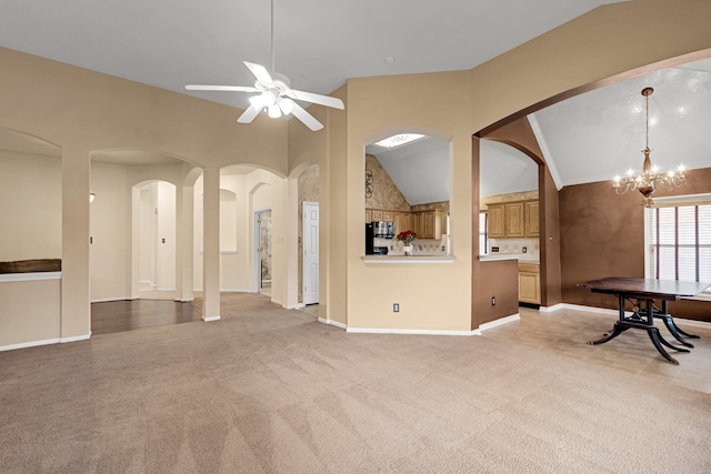 living room featuring ceiling fan with notable chandelier, lofted ceiling, and light carpet