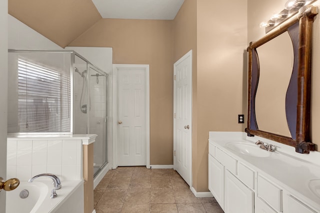 bathroom with vanity, tile patterned floors, separate shower and tub, and vaulted ceiling