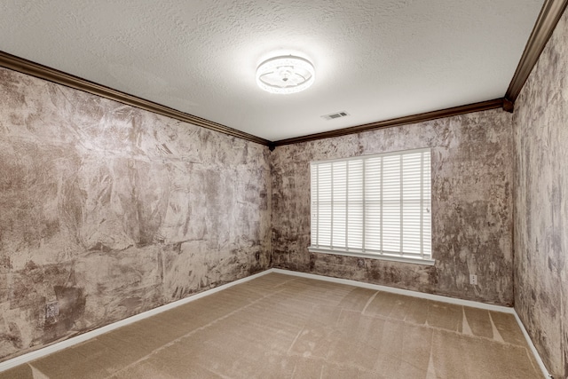 carpeted empty room with a textured ceiling and crown molding