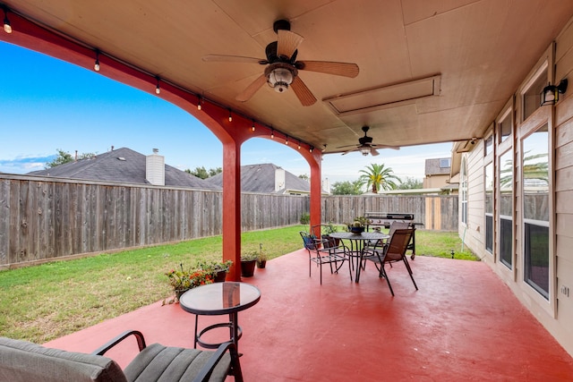 view of patio featuring ceiling fan