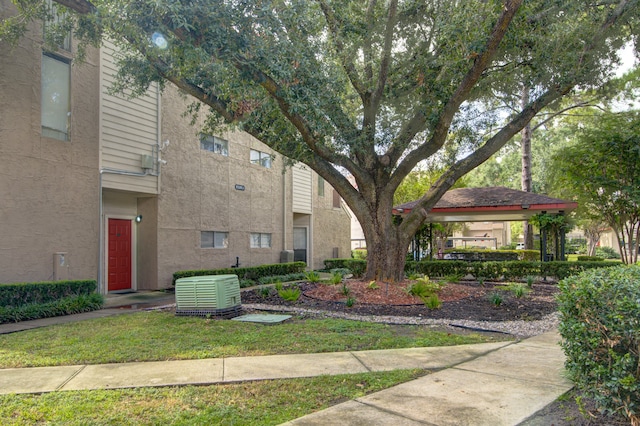 view of home's community with a lawn