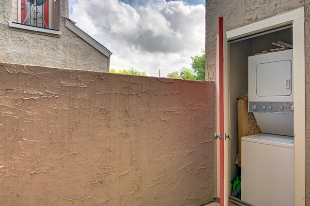 exterior space with stacked washing maching and dryer