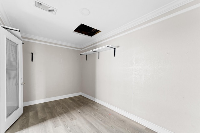 213 Super St, Houston, TX 77011 - spare room with crown molding, wood finished floors, and baseboards