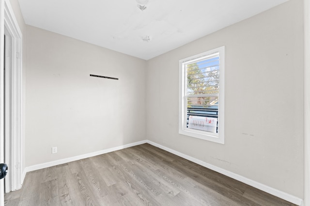 unfurnished room with light hardwood / wood-style flooring