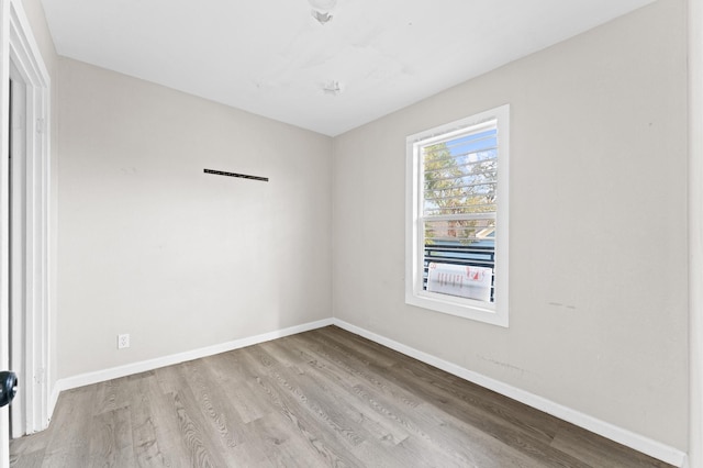 213 Super St, Houston, TX 77011 - empty room with wood finished floors and baseboards