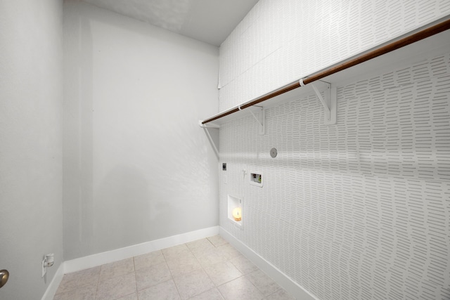 2215 Rose Manor Ct, Richmond, TX 77469 - laundry area with electric dryer hookup, baseboards, light tile patterned flooring, and gas dryer hookup