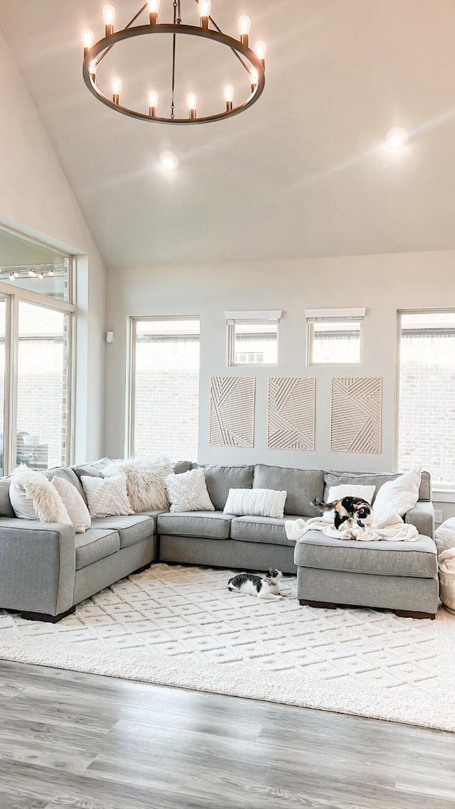 2215 Rose Manor Ct, Richmond, TX 77469 - living area with a chandelier, wood finished floors, vaulted ceiling, and recessed lighting