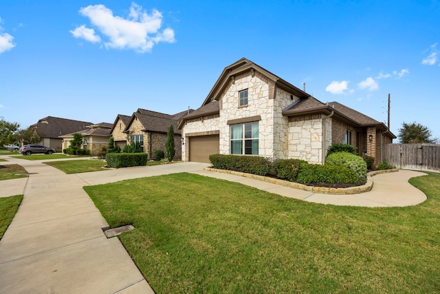 view of front of home with a front lawn and a garage