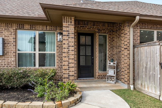2215 Rose Manor Ct, Richmond, TX 77469 - doorway to property featuring a shingled roof and brick siding