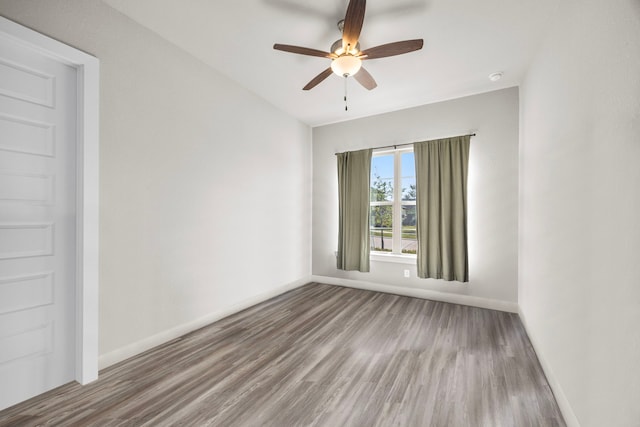 2215 Rose Manor Ct, Richmond, TX 77469 - empty room featuring baseboards, wood finished floors, and ceiling fan