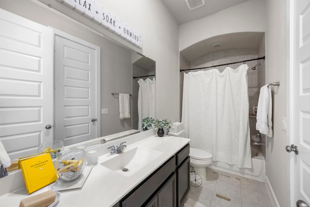 full bathroom featuring toilet, shower / bath combination with curtain, vanity, and tile patterned floors