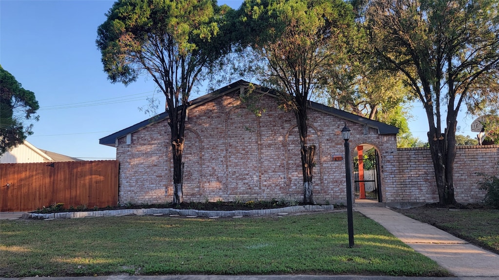 view of home's exterior featuring a lawn