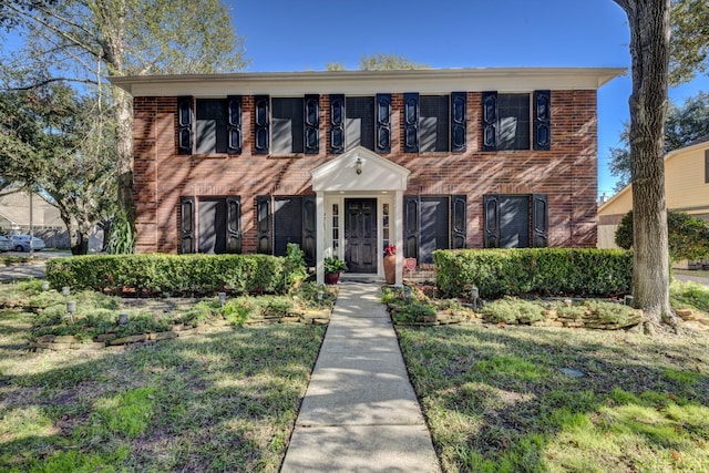 colonial house with a front lawn