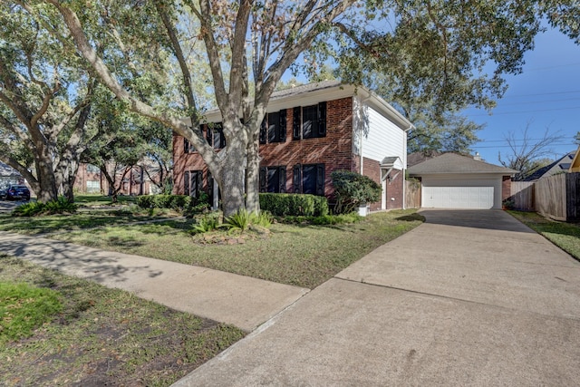 view of front of property featuring a garage and a front yard