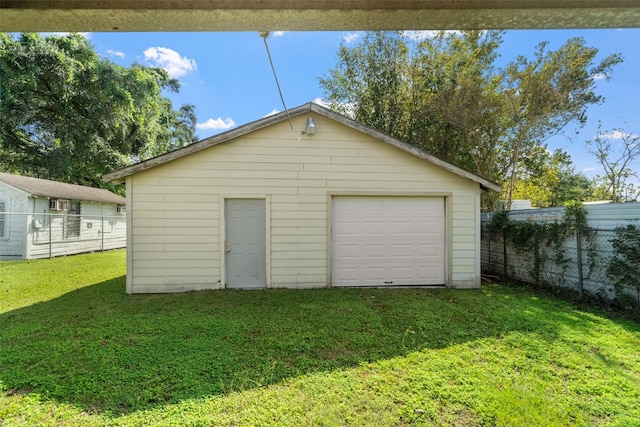 garage featuring a yard