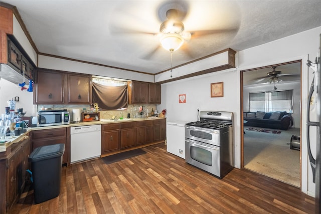 kitchen featuring sink, ceiling fan, appliances with stainless steel finishes, dark hardwood / wood-style flooring, and dark brown cabinetry