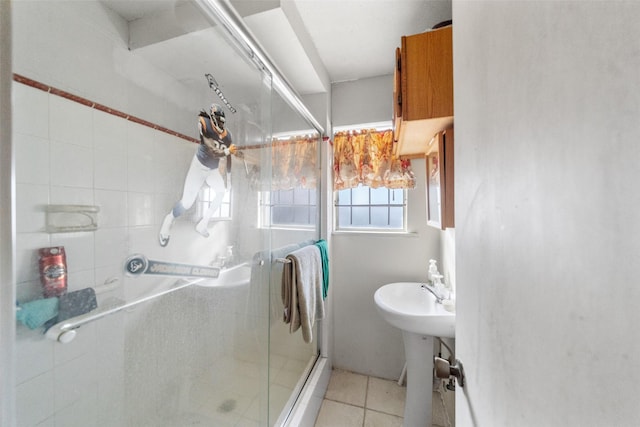 bathroom featuring tile patterned floors and an enclosed shower