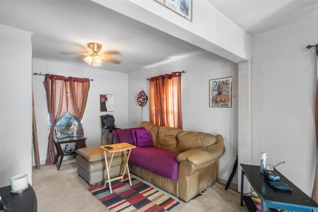 living room featuring light carpet and ceiling fan