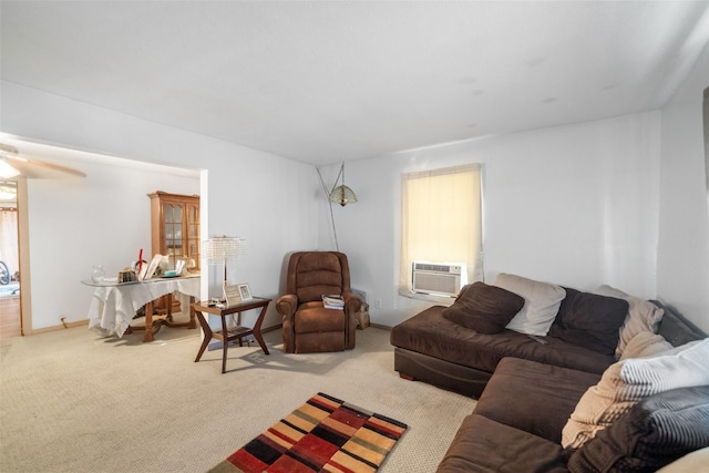 living room featuring a wall mounted AC, ceiling fan, and light colored carpet