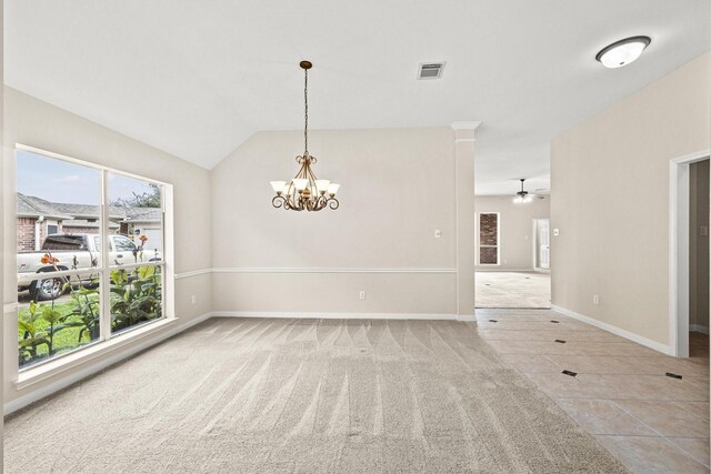 empty room with plenty of natural light, carpet floors, and ceiling fan with notable chandelier