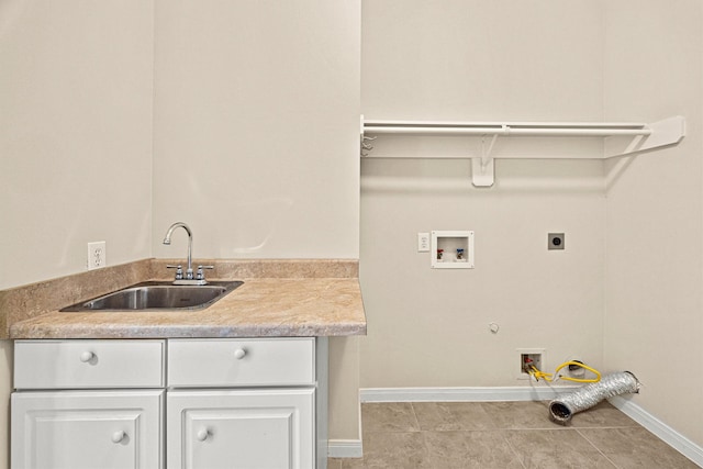 laundry room with electric dryer hookup, cabinets, sink, hookup for a washing machine, and light tile patterned flooring