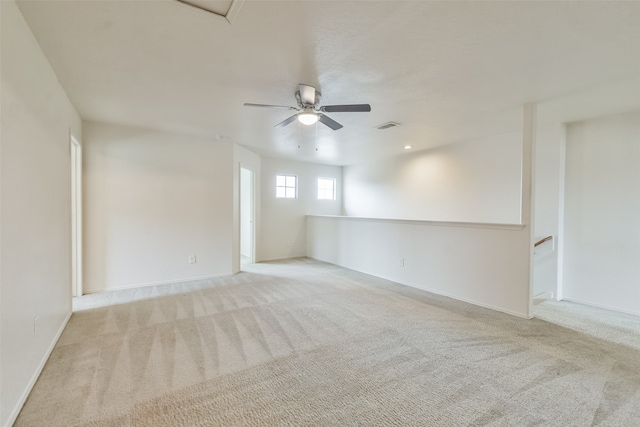 carpeted empty room with ceiling fan