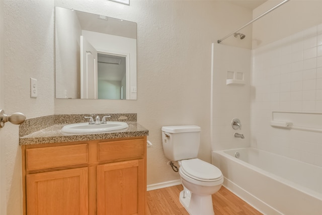 full bathroom featuring vanity, wood-type flooring, toilet, and tub / shower combination