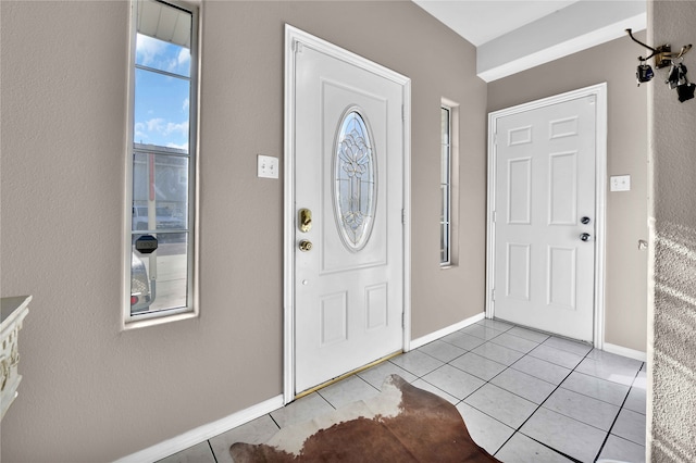 foyer featuring light tile patterned floors