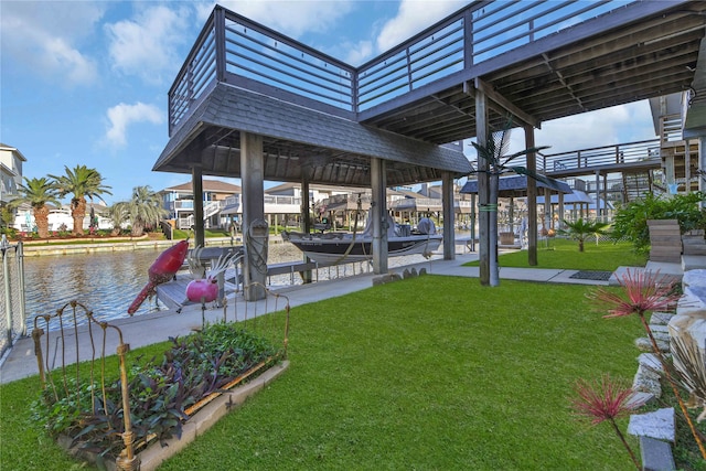 view of dock featuring a yard and a water view