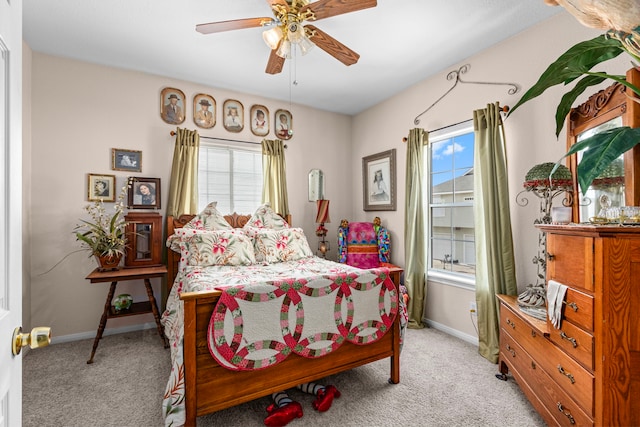 bedroom with light colored carpet and ceiling fan