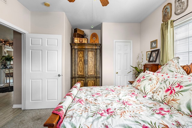 carpeted bedroom with ceiling fan