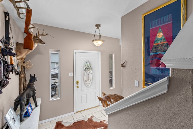 entrance foyer featuring light tile patterned flooring