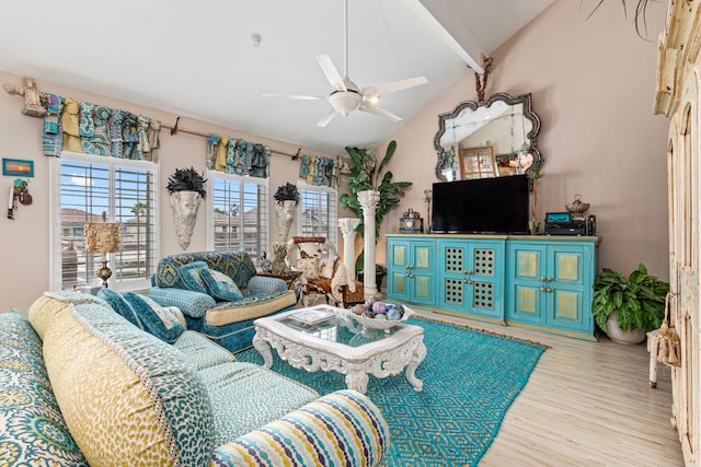 living room featuring ceiling fan, vaulted ceiling, and light hardwood / wood-style floors