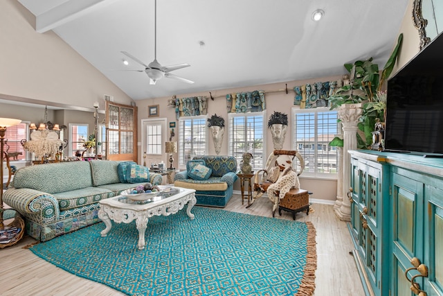 living room featuring beamed ceiling, ceiling fan with notable chandelier, light hardwood / wood-style flooring, and high vaulted ceiling