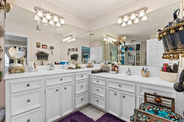 bathroom with tile patterned flooring and vanity