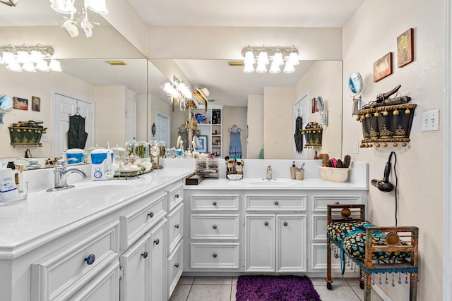 bathroom with tile patterned flooring and vanity