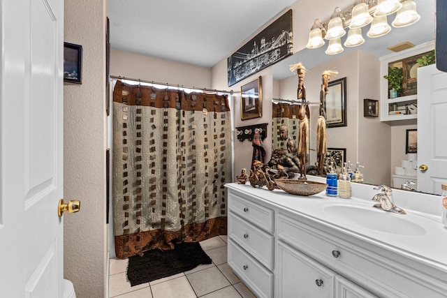 bathroom with tile patterned flooring, vanity, and a shower with curtain