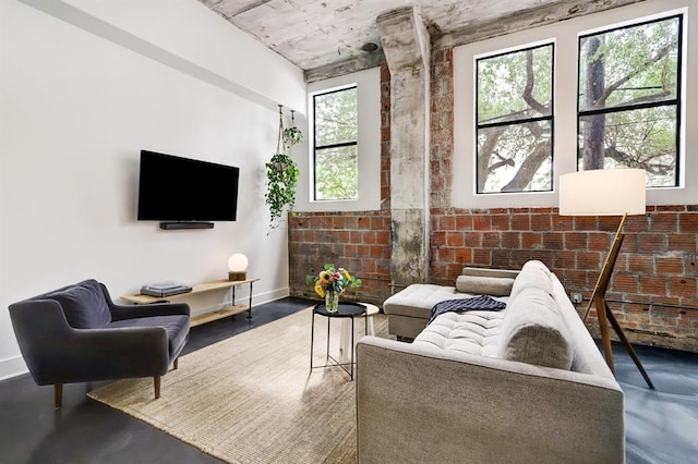 living room with plenty of natural light and concrete floors