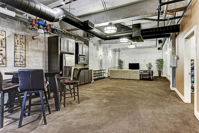 interior space with carpet, visible vents, and appliances with stainless steel finishes