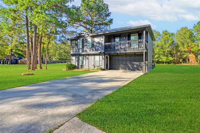 view of front facade with a balcony, a garage, and a front yard